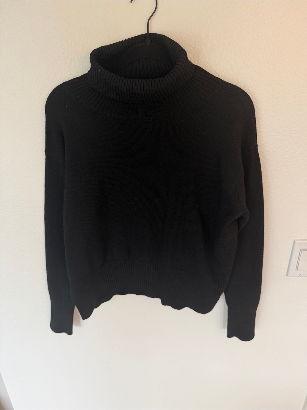 Noli Black Ribbed Turtleneck Sweater with side slits
